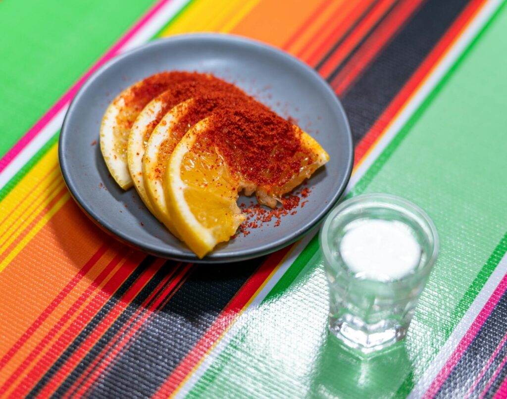 A plate of food with a slice of orange on it