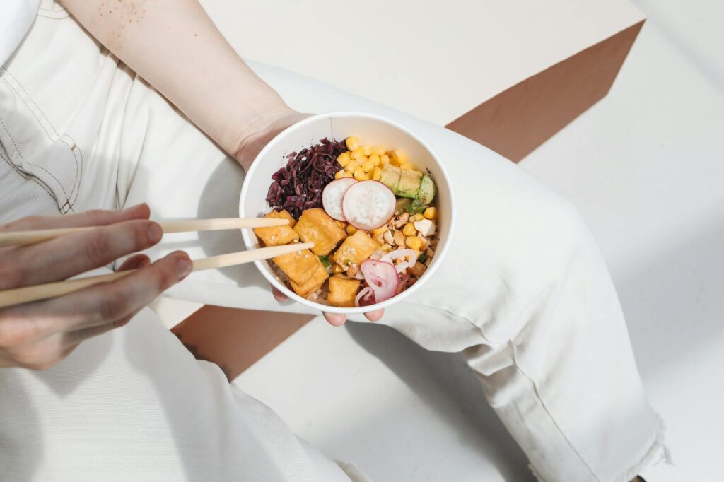 Photo of a Person Holding a Poke Bowl